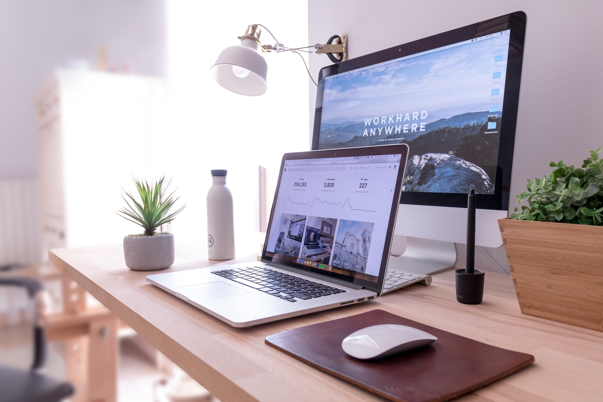 laptop and monitor sitting on a desk